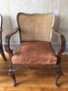 vintage caned arm chairs